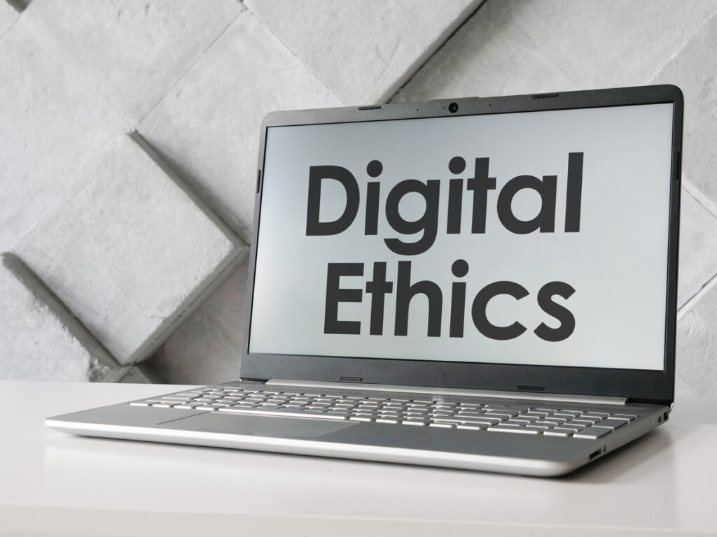 Digital ethics is shown on a business photo using the text